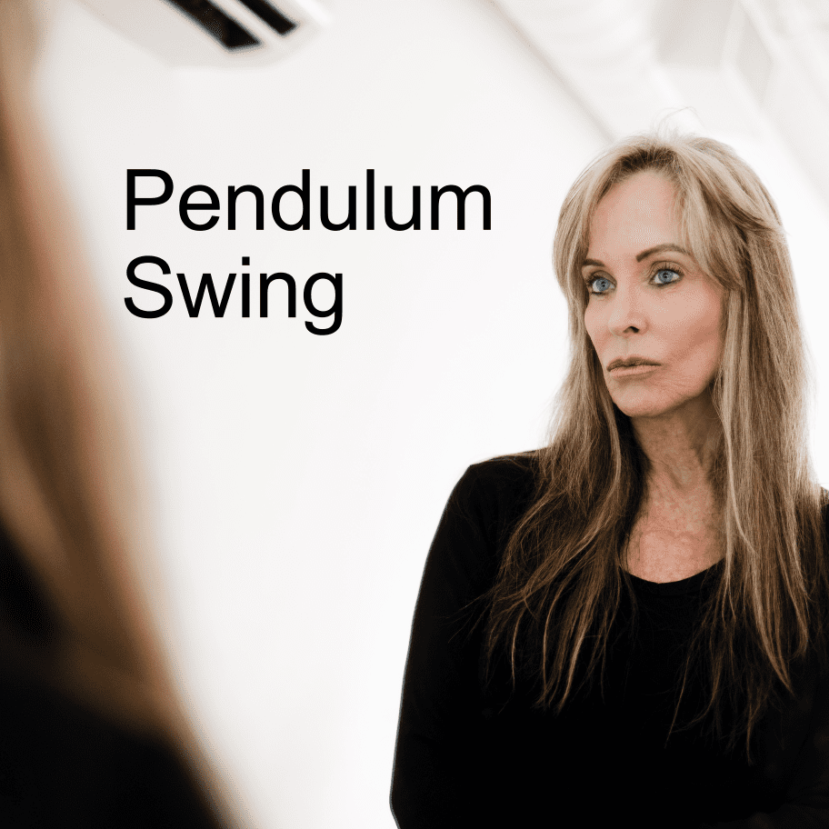 A woman standing in front of a mirror with the words pendulum swing.