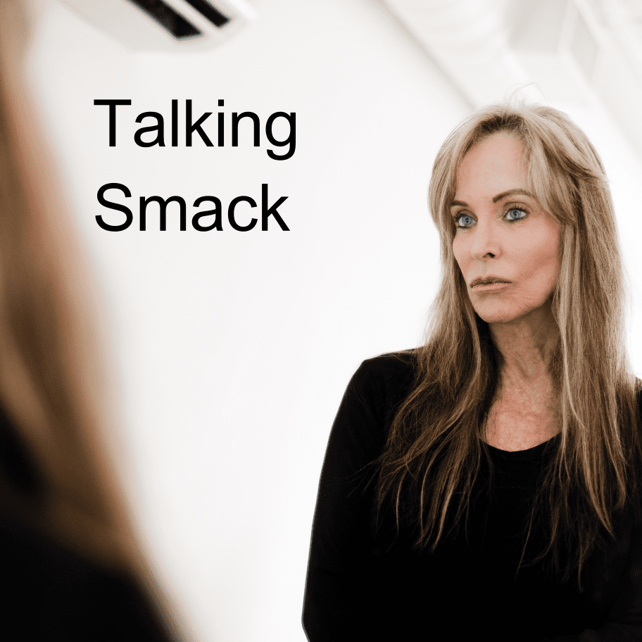 A woman standing in front of a mirror with the words 